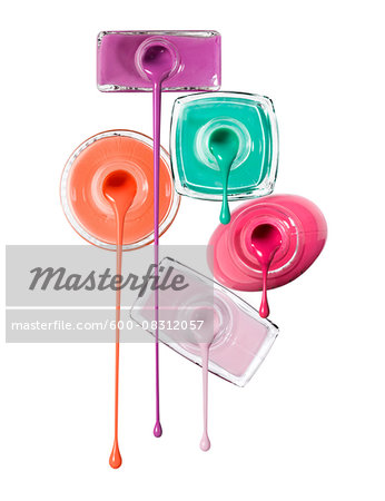 Close-up of Nail Polish Dripping from Bottles on White Background Close-up of Nail Polish Dripping from Bottles on White Background