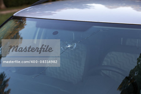 Smashed windscreen of a car, damaged glass