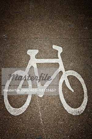 Close up of white bike painted on asphalt