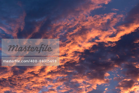 Brilliant orange colored clouds during a morning sunrise