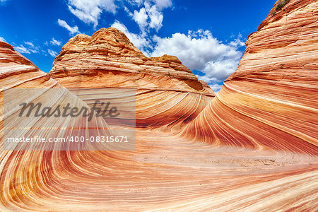 The Wave is an awesome vivid swirling petrified dune sandstone formation in Coyote Buttes North. It could be seen in Paria Canyon-Vermilion Cliffs Wilderness, Arizona. USA