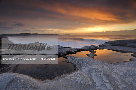 Sunrise and reflections at Yena located in Botany Bay National Park lpart of the Kurnell Peninsula.  Views north east