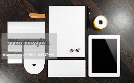Blank corporate identity template on dark wooden background. For design presentations and portfolios.