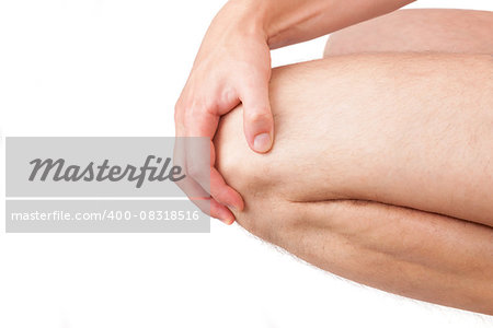 Man holding his naked knee isolated on white background. Knee injury and pain. Knee detail, close up.