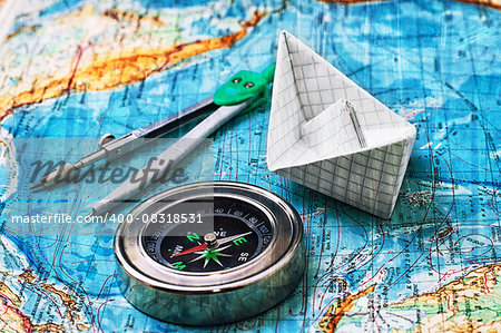 Compass on old nautical map vintage style.Applied texture.