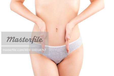 Beautiful woman isolated on white background touching her stomach. Feminine health problems.