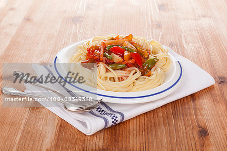 Spaghetti pasta with tomato sauce and steamed vegetables. Healthy pasta eating.