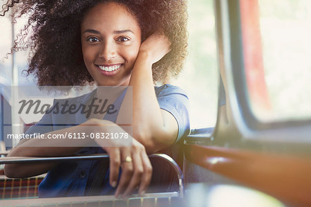 Portrait smiling woman riding bus Portrait smiling woman riding bus