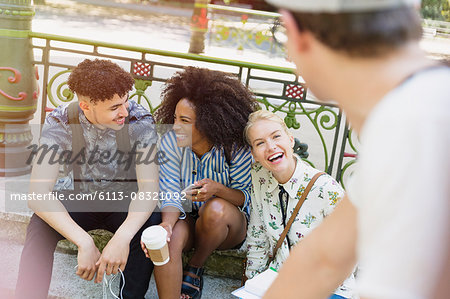 Friends hanging out in park