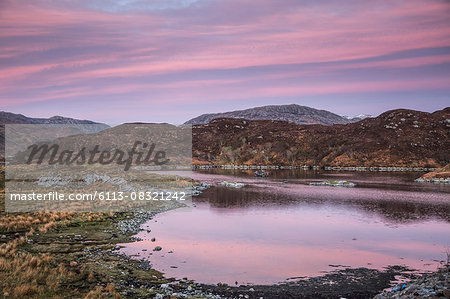 Pink sunrise sky over Badcall Bay, Sutherland, Scotland