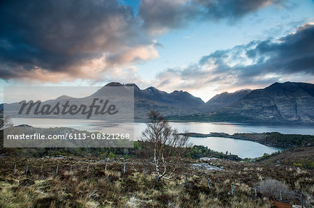 Scenic view clouds over calm mountains and lake, Russel Burn, Applecross, Scotland