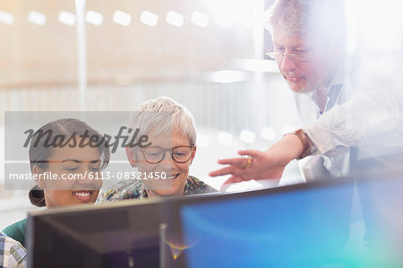 Business people working at computer in office