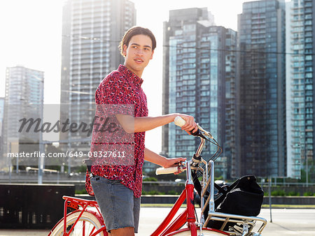 Young man on bicycle, Southbank, Melbourne, Australia