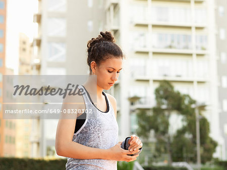 Young woman wearing wrist  weight in park
