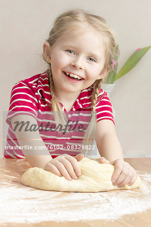 Girl making dough