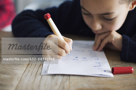 Girl doing homework, close-up