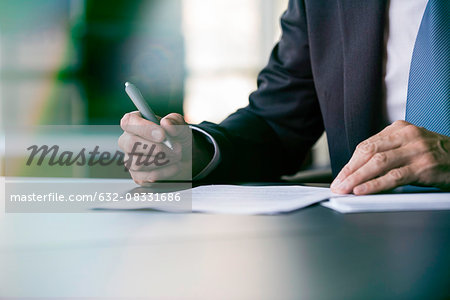 Executive writing letter by hand