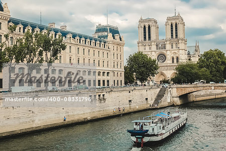 Paris, Notre Dame  with boat on Seine, France