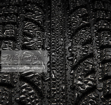 Close-up texture of tire with water drops