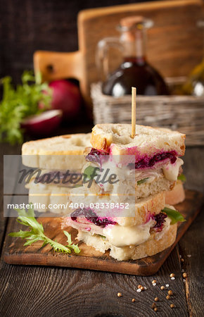 Turkey sandwich with cheese sauce and beetroot jam.