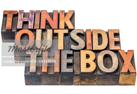 think outside the box - motivational phrase in vintage letterpress wood type, stained by ink, isolated on white