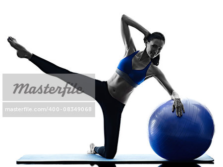 one caucasian woman exercising pilates ball exercises fitness in silhouette isolated on white backgound