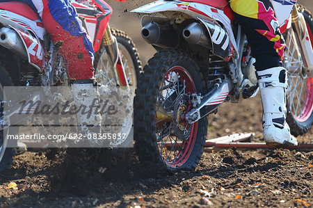 Motocross bikers on dirt track