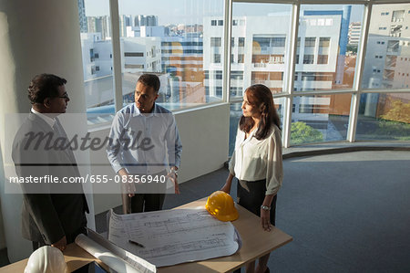 Singapore, Architect discussing building plans with customers