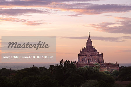 Scenic colorful sunset of ancient temple in Bagan with dramatic clouds, Myanmar