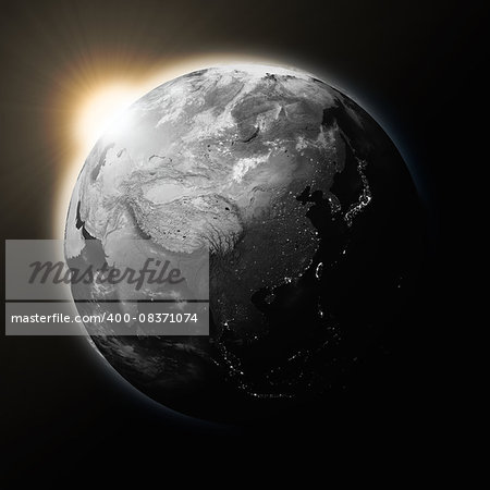 Sun over Southeast Asia on dark planet Earth isolated on black background. Highly detailed planet surface. Elements of this image furnished by NASA.