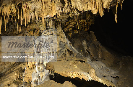 Illuminated dropstones, stalactites in the Szent Istvan cave (Hungary, Miskolc,  Lillafured).