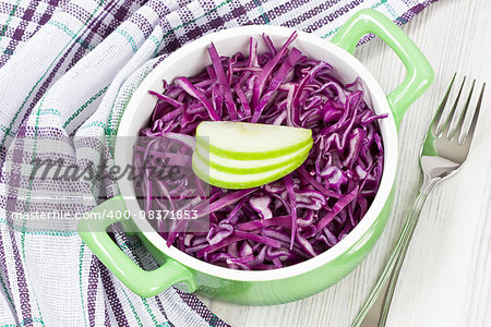 Delicious fresh healthy red cabbage salad with apple in bowl