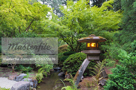 Stone Lantern Lit with Candles at Portland Japanese Garden in the Evening