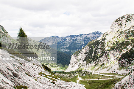Trip to the KRN Slovenia 2245 mountain in summer time with green grass and ncie clouds