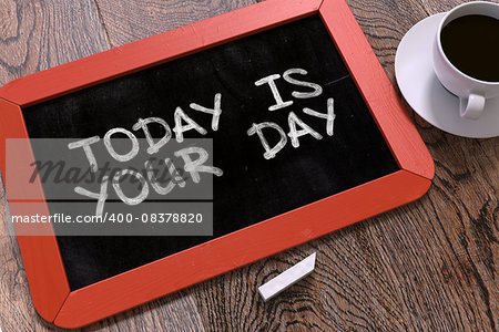 Handwritten Today is Your Day on a Red Chalkboard. Top View Composition with Chalkboard and White Cup of Coffee. 3d Illustration.