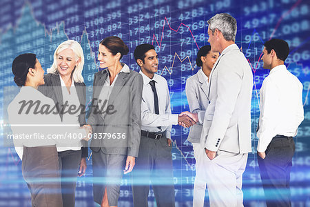 Business people speaking together  against stocks and shares