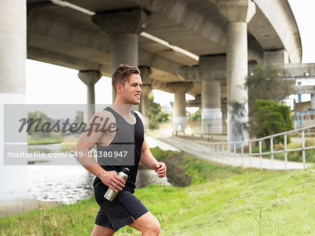 Young man running, outdoors