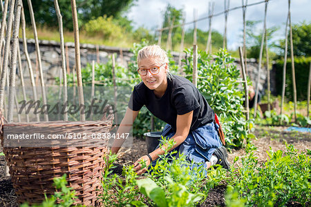 Young woman working in garden