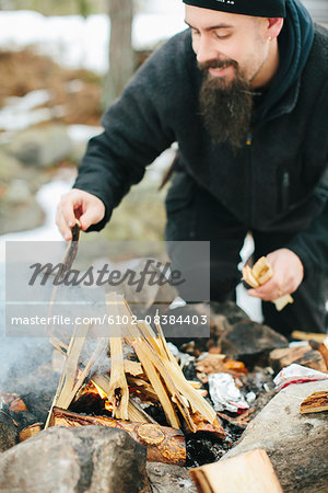 Man making campfire