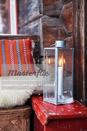 Candle burning inside lantern