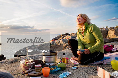 Woman preparing food during camping