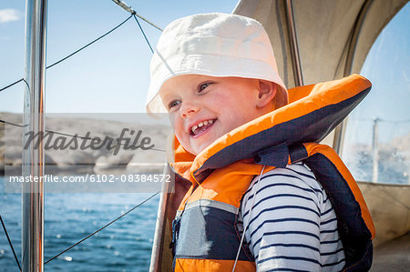 Smiling boy wearing life jacket