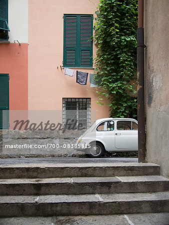 Typical Tuscan Street with Laundry on Clothesline and Fiat Car, Tuscany, Italy