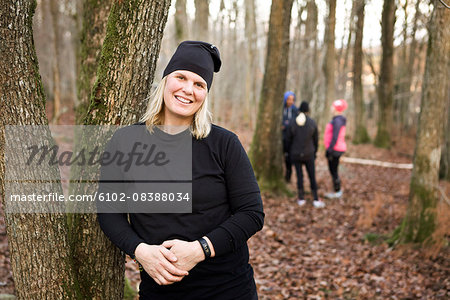 Smiling woman in forest