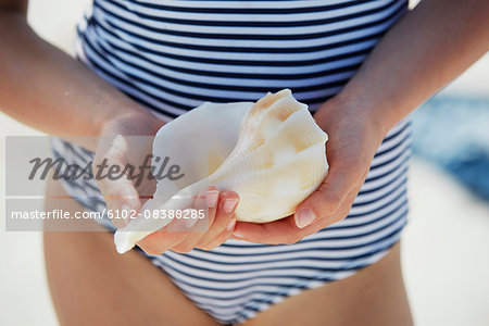 Girl holding shell