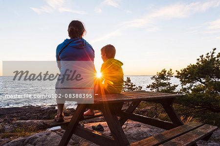 Mother with son at sunset