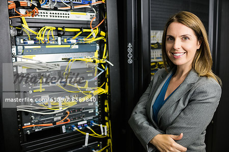 Confident technician smiling at camera