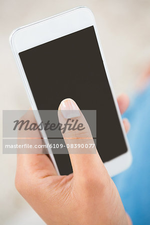 Close up view of a woman holding smartphone