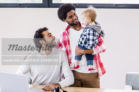 Happy gay couple with child