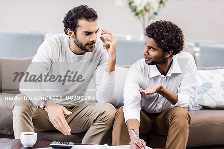 Gay couple paying bills